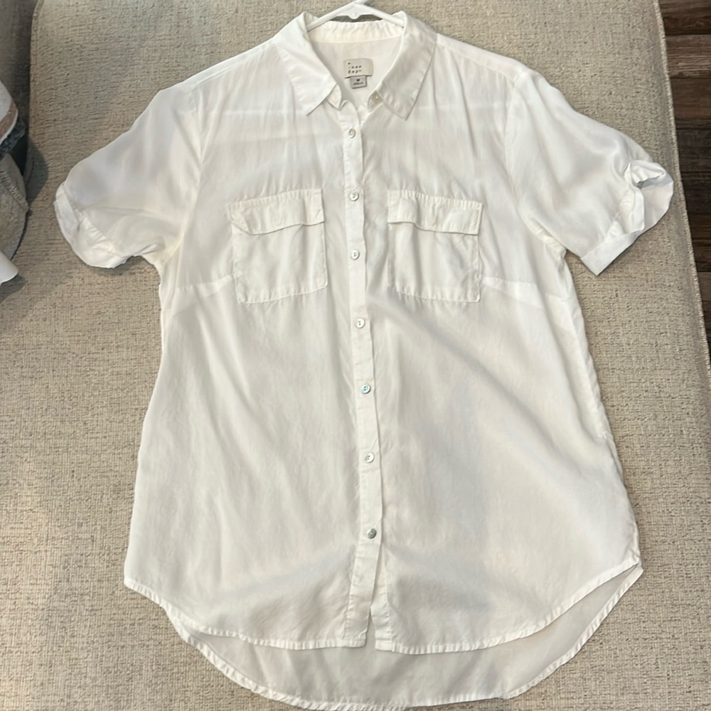 A new day, white, short- sleeve shirt.